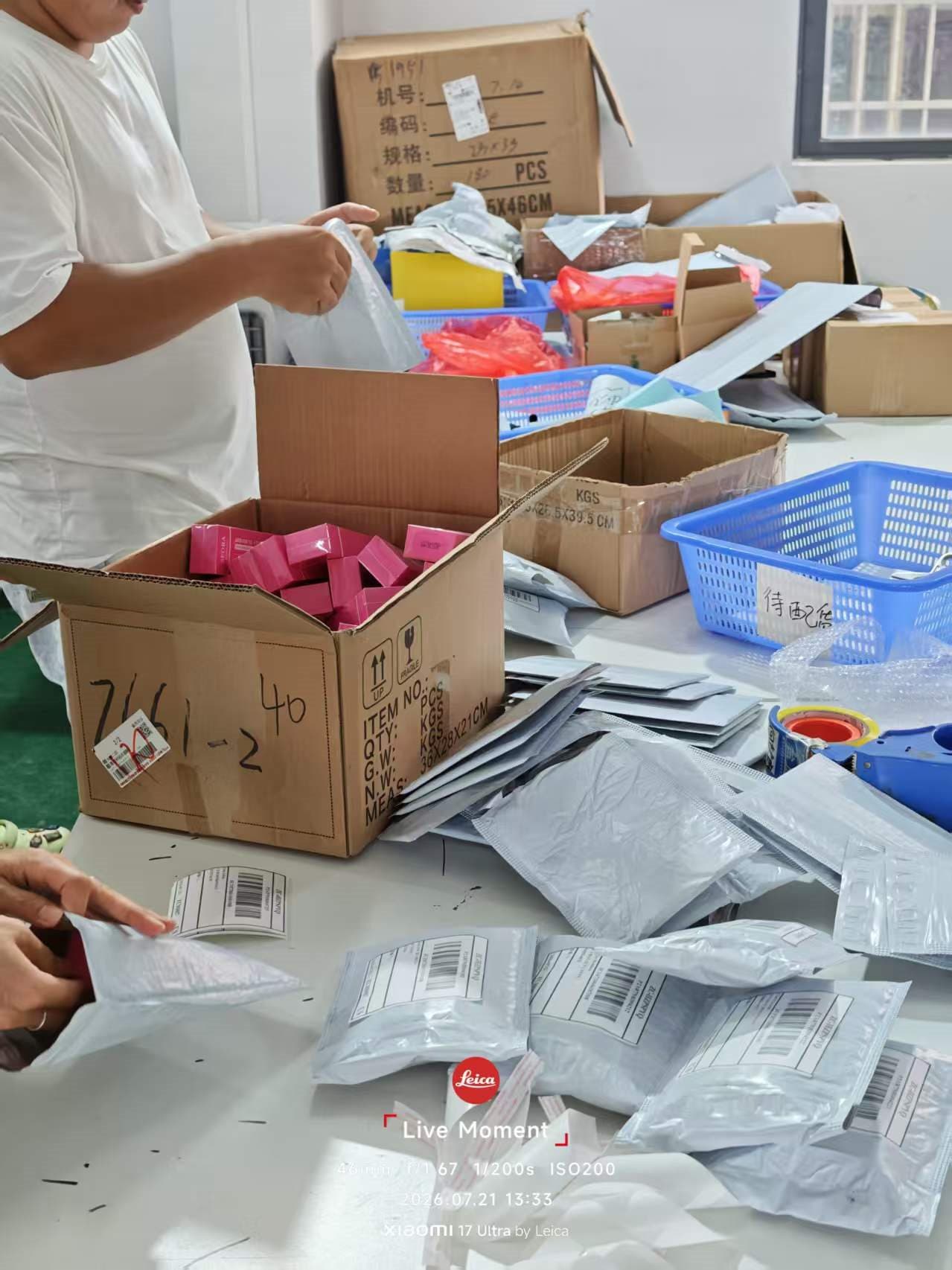 Parcels being prepared at a PT5 warehouse packing table